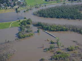 Aerial shot of flooding in Brandon. The the pedestrian bridge at the Discovery Centre is nearly submerged July 5, 2014. (Courtesy of eBrandon.ca)
