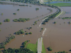 Aerial shot of flooding in Brandon, Man., with water over 1st Street between Dinsdale Park and Optimist Soccer Park, July 5, 2014. (Courtesy of eBrandon.ca)