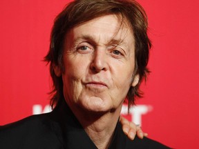Paul McCartney poses at the 2012 MusiCares Person of the Year tribute honoring McCartney in Los Angeles, in this February 10, 2012 file photo.  REUTERS/Danny Moloshok/Files