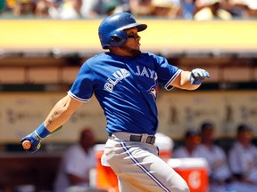 Blue Jays’ Melky Cabrera hits an RBI groundout against the A’s in the sixth inning in Oakland on Sunday. The Blue Jays lost 4-2.