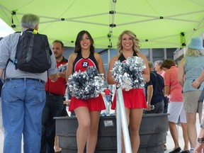 RedBlacks cheerleaders Brittany Greene, left, and Kayla Troughton welcomed residents to a slick tour of the team's new home at the still-unfinished Lansdowne Park Sunday, July 6, 2014.
Megan Gillis/Ottawa Sun