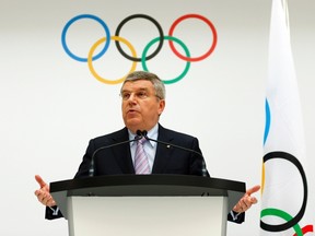 International Olympic Committee (IOC) President Thomas Bach announces the 2022 Olympic Winter Games candidate cities at the IOC headquarters in Lausanne July 7, 2014. Oslo, Almaty and Beijing were confirmed by the IOC as the official candidates to host the 2022 Winter Olympic Games on Monday. REUTERS/Denis Balibouse