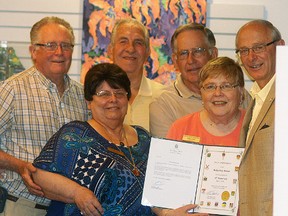 Lambton-Kent-Middlesex MP Bev Shipley, right, presents a certificate to Wallaceburg Museum to mark their 30thanniversary. Accepting the certificate are Wallaceburg Museum board members, Lee Burrows, Roger VanBellinghen, Bob DeKoning, Louise Benn and Elaine Gatt.