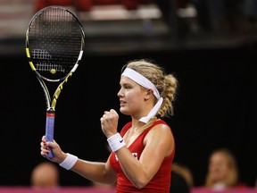 Canada's Eugenie Bouchard celebrates after defeating Slovakia's Jana Cepelova during their Fed Cup tennis match at the PEPS stadium at Laval University on April 20, 2014. (REUTERS/Mathieu Belanger)