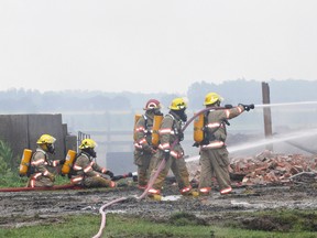 Firefighters battled a barn fire in Logan ward, just northwest of Bornholm, early Monday, July 7. KRISTINE JEAN/MITCHELL ADVOCATE