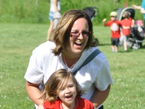 Shannon Cook helped daughter Rickenna down the sack race course during last Tuesday’s Canada Day festivities at Lions Park, hosted by the Mitchell Rotary Club. ANDY BADER/MITCHELL ADVOCATE