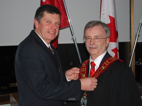 David Marr, right, is seeking the mayor's chair in the Municipality of Central Elgin. The long-time councillor is currently deputy mayor of Central Elgin and warden of Elgin county. He's pictured here with 2013 warden Cameron McWilliam, who is adjusting the warden's chain of office. (File photo)