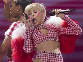 Miley Cyrus performs on stage during her concert at the Ziggo Dome in Amsterdam, on June 22, 2014, as part of her Bangerz Tour. AFP PHOTO / ANP / PAUL BEREGN