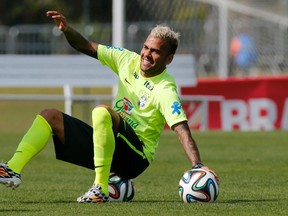 Brazil's Daniel Alves attends a training session in Teresopolis near Rio de Janeiro on Monday, July 7, 2014. (Marcelo Regua/Reuters)