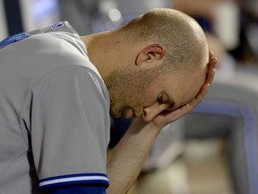Blue Jays starting pitcher J.A. Happ sits in the dugout after being pulled from the game in the fifth inning against the Los Angeles Angels in Anaheim on Monday, July 7, 2014. (Jayne Kamin-Oncea/USA TODAY Sports)