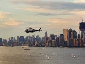 A New York Police Department helicopter flies over Manhattan while on patrol above New York in this August 31, 2011 file photo. (REUTERS/Lucas Jackson)
