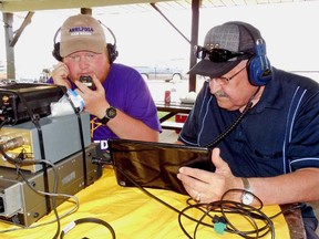 Jamie Sproule, left, makes contacts while Bob Sacerty logs contacts at the Lambton County Radio Club's Field Day event at Krall Park, on Saturday.