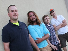 Basement Bound from left to right: Garret Gauthier (guitar), Sidney Wilpstra
(vocals), Pierre Chouffot (guitar) and Nick Wilpstra (drums). The band recorded a rock song about Strathroy, won two contests to gain recording time and perform their original songs locally. ELENA MAYSTRUK/ AGE DISPATCH/ QMI AGENCY