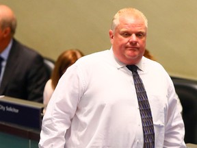 Mayor Rob Ford attends a city council meeting on Tuesday, July 8, 2014. (DAVE ABEL/Toronto Sun)
