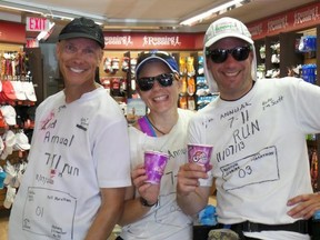 David Fielder, Melissa Budd and Scott Burton enjoy a Slurpee on one of their stops from last year's 7-Eleven Run. They will make their fifth annual run on Friday, when they plan to run about 30 miles and stop for free Slurpees at 21 locations in about eight hours.