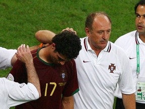 Portugal coach Luiz Felipe Scolari consoles Cristiano Ronaldo during the 2006 World Cup in Germany. (Alex Grimm/Reuters/Files)