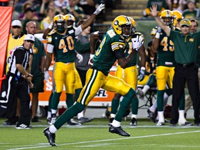 Eskimos corner Patrick Watkins legs it out to the end zone during Friday night's CFL game against Hamilton (Codie McLachlan, Edmonton Sun).