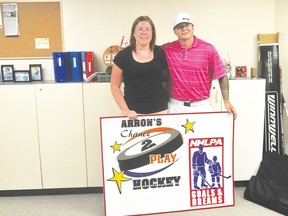 Child and Family Services of Central Manitoba Foundation administrator Nancy Funk, left, and Portage la Prairie pro hockey player Arron Asham on Tuesday at the CFS building in Portage la Prairie. (Kevin Hirschfield/THE GRAPHIC)