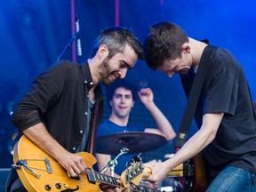 Tokyo Police Club (L-R) guitarist Josh Hook, drummer Greg Alsop and bassist David Monks, shown performing at Bluesfest in July, 2014. they've been named one of the headline acts for the Ottawa Dragon Boat Festival in June. Errol McGihon/Ottawa Sun/QMI Agency