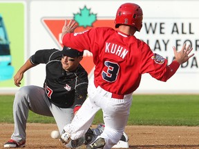 Winnipeg Goldeyes shortstop Tyler Kuhn slides into second against  Sioux City Explorers second baseman Amos Ramon during American Association baseball in Winnipeg, Man. Tuesday July 08, 2014.
Brian Donogh/Winnipeg Sun/QMI Agency