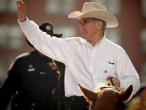 Alberta PC leadership candidate Jim Prentice during the Calgary Stampede Parade in Calgary, Alta. on Friday July 4, 2014. (Al Charest/Calgary Sun)