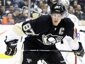 Pittsburgh Penguins centre Sidney Crosby played through a wrist injury during the NHL playoffs, according to the Pittsburgh Post-Gazette. (USA Today)