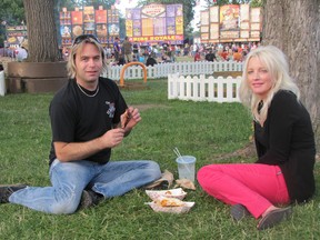 Joel Laprise and Julie Richmond enjoy a picnic on the grass at Tecumseh Park on July 5 during Chatham-Kent Ribfest. This year's event benefitted from warm, dry weather and attendance was up.