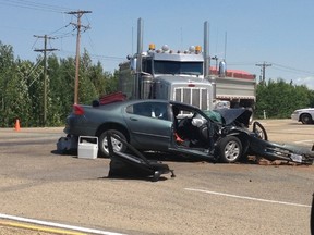 Two people from Nanaimo, B.C. are dead after their car hit a gravel truck in Wetaskiwin Tues., July 8, 2014. Submitted photo by DEANA CRIER/Edmonton Sun/QMI Agency