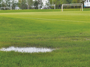 One of the main soccer fields at Republic of Manitobah Park was a little damp Monday night, a common sight over the last month. (Kevin Hirschfield/The Graphic)