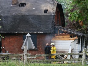 Investigators from the office of the Ontario Fire Marshal Office and Grey County O.P.P. at the scene of an early morning blaze that sent four people to hospital.