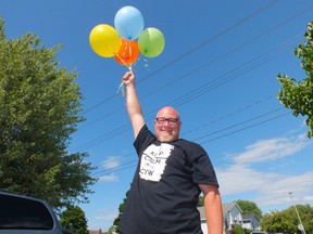 Andrew Thomas received a $1000 grant from the Awesome Foundation to release 1,000 biodegradable balloons and see where the wind takes them. (BRENT BOLES, The Observer)