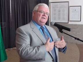 Auditor general Ken Hughes answers questions from reporters at City Hall after tabling a scathing audit on the green bin contract. JON WILLING/OTTAWA SUN