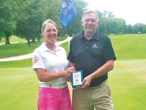 Rhonda Orr, left, poses with Portage Credit Union CEO Dave Omichinski after her 74 in the Portage Ladies Open earned her the title. (Kevin Hirschfield/The Graphic/QMI Agency)