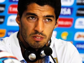 Uruguay's Luis Suarez speaks to the media before a training session at Dunas Arena Natal, Brazil, June 23, 2014. (Reuters)