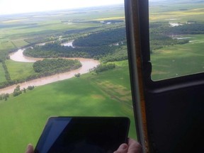 EMO Minister Steve Ashton tours the flood-affected Assiniboine River. (TWITTER.COM)