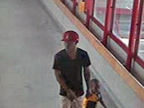 A security camera image allegedly shows the boy, 2, and his father Kevyn Lex Menard, 24, at Tunney's Pasture. Police say the boy had been abducted from a nearby park Thursday, July 10 at noon. (Submitted image)