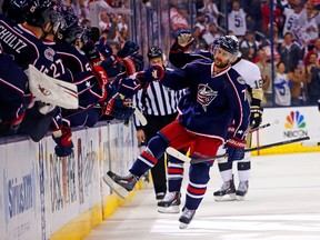 Nick Foligno of the Columbus Blue Jackets is congratulated by his teammates after scoring a goal against the Pittsburgh Penguins during the third period of Game Six of the First Round of the 2014 NHL Stanley Cup Playoffs at Nationwide Arena on April 28, 2014 in Columbus, Ohio.