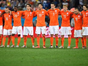 Netherlands' national soccer players react as teammate Ron Vlaar misses an opportunity to score a goal against Argentina during a penalty shoot-out at their 2014 World Cup semi-finals at the Corinthians arena in Sao Paulo July 9, 2014.  (REUTERS/Dylan Martinez)