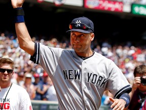 Yankees shortstop Derek Jeter (2) waves to the crowd during a pre-game ceremony for his pending retirement. Mandatory Credit: Bruce Kluckhohn-USA TODAY Sports