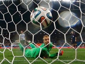 Jasper Cillessen of the Netherlands watches as he fails to stop the decisive penalty shot by Argentina's Maxi Rodriguez during their penalty shootout in their 2014 World Cup semifinals at the Corinthians arena in Sao Paulo July 9, 2014. (REUTERS)