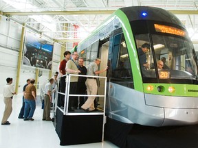 Bombardier employees check out a Flexity Freedom LRV prior to a presentation at a hangar in their aerospace facility in Toronto in this May 29, 2012 file photo. (Ernest Doroszuk/QMI Agency)