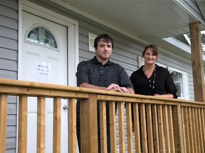 Ted Rumsey and Sam Klingenberg of Comfort Homes are shown outside the Ashton model show house in Woodstock. (CRAIG GLOVER, The London Free Press)