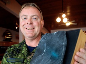 Master Corporal William Woods poses for a photo with a fragment of the Canadian Cenotaph in Kandahar that he donated to the legion in his home town of Nipawin Saskatchewan, June 5, 2012. Woods was at the Norwood Legion in Edmonton, 11150 - 82 Street, for a press conference to publicize a retreat for injured soldiers called the Wounded Warriors Weekend. (NOTE: fragment is from the floor/base of the Cenotaph. Cenotaph was not destroyed.) DAVID BLOOM EDMONTON SUN  QMI AGENCY