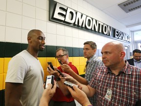 Ottawa RedBlacks Marcus Henry (left) speaks to the media near the Edmonton Eskimos' dressing room at Commonwealth Stadium in Edmonton Thursday. David Bloom/Edmonton Sun/ QMI Agency