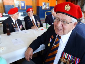 Doug Buck, right, of Bayside sits with fellow Hastings and Prince Edward Regiment veterans George Swoffer, left, and George Wright, both of Picton, Thursday in Belleville. Members of the regiment, along with members of Toronto's 48th Highlanders the national Royal Canadian Regiment, marked the 71st anniversary of their veterans' invasion of Sicily during the Second World War.