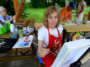 Michelle Haley, of the Gallery Painting Group, is working in the historic Blackfriars community. (MORRIS LAMONT, The London Free Press)