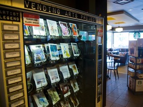 When shoppers buy art from this vending machine, now at a  Starbucks, the money is split with the concept?s creator and the artists whose work it features. (MIKE HENSEN, The London Free Press)