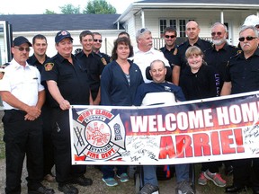 Arrie Turner is surroundered by family and Rodney firefighters after returning home from Parkwood hospital following six months of treatment. Turner was injured back in January when his vehicle went out of control while responding to a fire call on a morning when driving conditions were treacherous.
