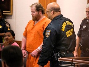Ronald Lee Haskell, 33, is shown in court in Houston, Texas July 12, 2014. He is accused of killing four children aged 4 to 14 and their parents, Stephen and Katie Stay, in the Houston suburb of Spring. Haskell collapsed when details of the murder scene were read in court. REUTERS/Brett Coomer/Pool