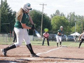The Calahoo Erins (green) had both parts of their game working on the weekend as they won the U21 B Women’s provincial fastball crown. When needed, the bats were there for them as well. Here, the hitter drives in a runner from third base as the Erin’s went on to beat the Wolves 14-2 in this game. - Gord Montgomery, Reporter/Examiner
